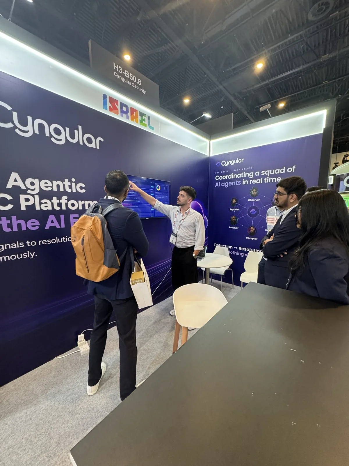 A Cyngular team member walking a group of visitors through the live dashboard.