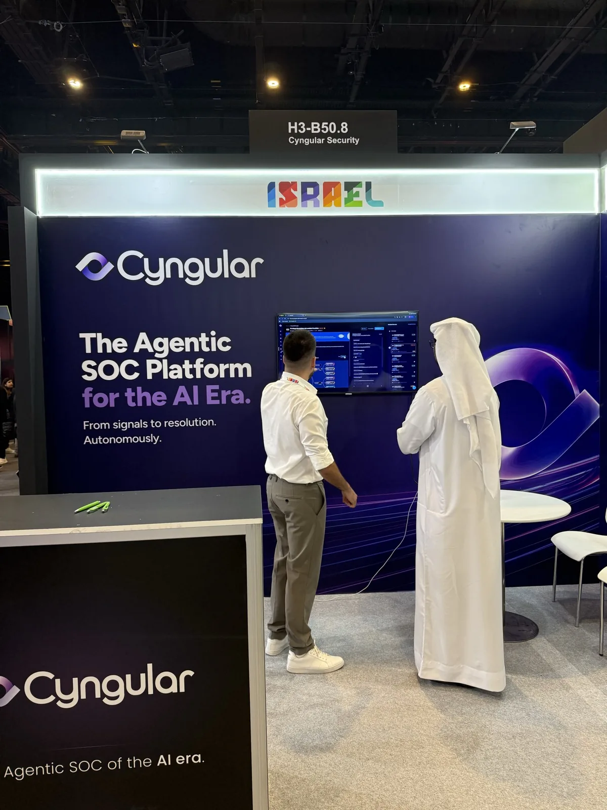 A visitor watching the Cyngular dashboard at the stand.